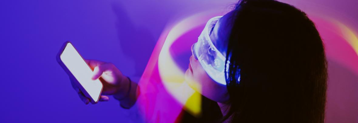 photo illustration of woman holding cell phone with light wrapped around her face and eyes