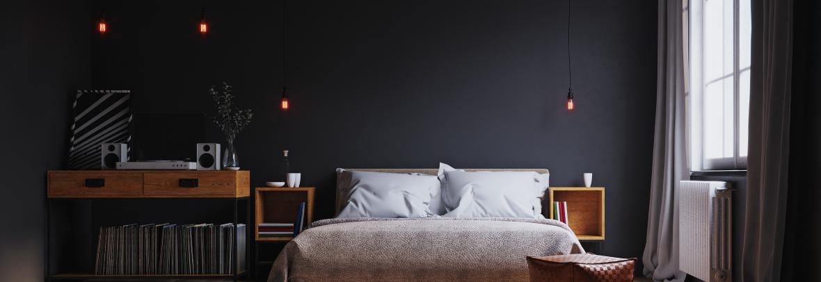 modern bedroom. black walls, single window, platform bed