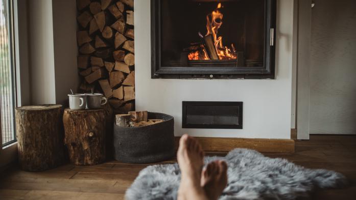 Feet near a fireplace 