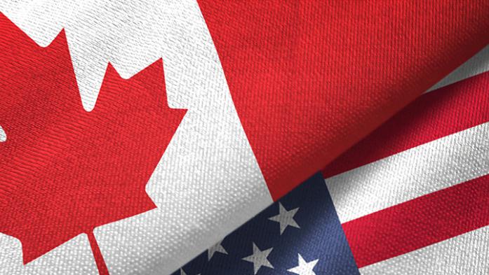 photo of Canadian and American flags folded together