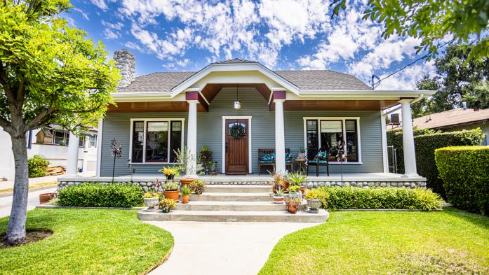A 1923 Craftsman Bungalow Home with a fresh coat of paint and columns
