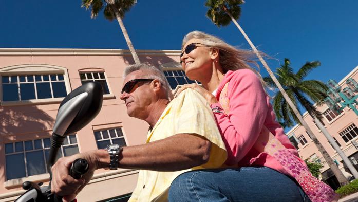 Mature couple on a scooter