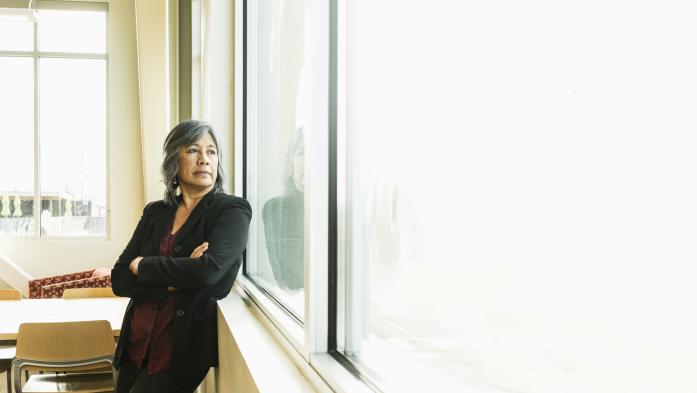 realtor looking out a window