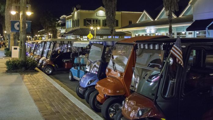 Electric carts parked along The Villages street