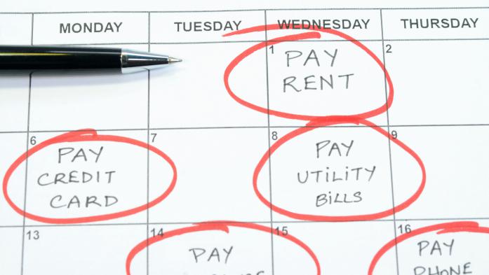 Calendar with bill due dates circled, including on that says pay rent