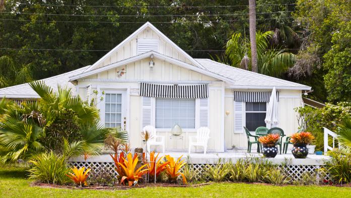 Older Florida home updated with paint and landscaping