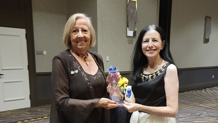 Christel Silver and Maria Grulich hold NAR's Global Platinum Award
